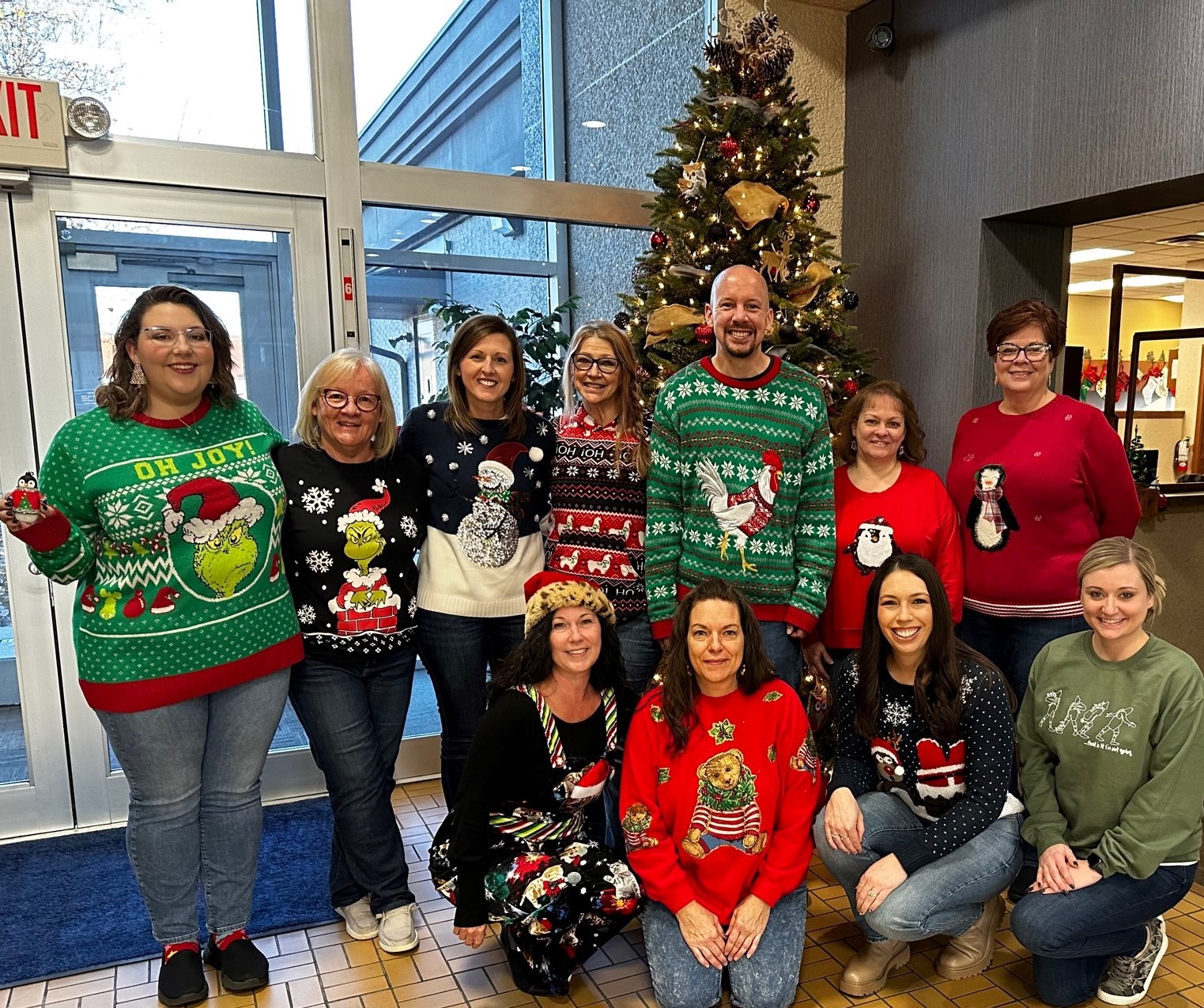 Employees enjoy a Christmas sweater-themed dress down day